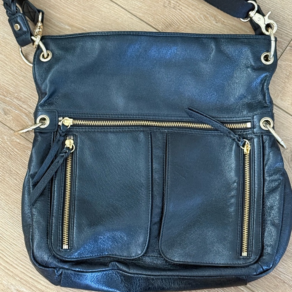 The Sak Black and Gold Crossbody Bag with Stylish Design